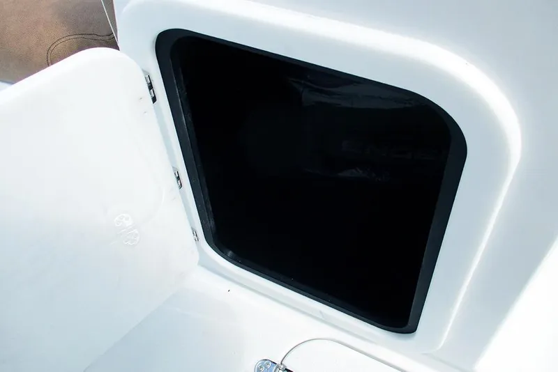 Slide: The Image of Open storage compartment on 2026 Stingray 20 SBX boat, showcasing interior space. - 34