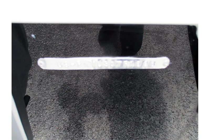 Slide: The Image of 2026 Stingray 20 SBX boat identification plate on a dark surface. - 35