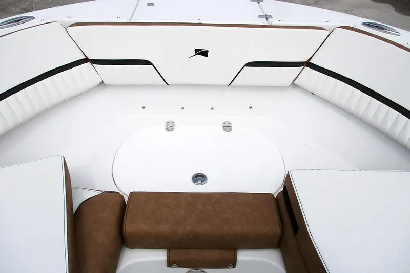 Slide: The Image of 2026 Stingray 20 SBX boat interior with white and brown seating. - 9