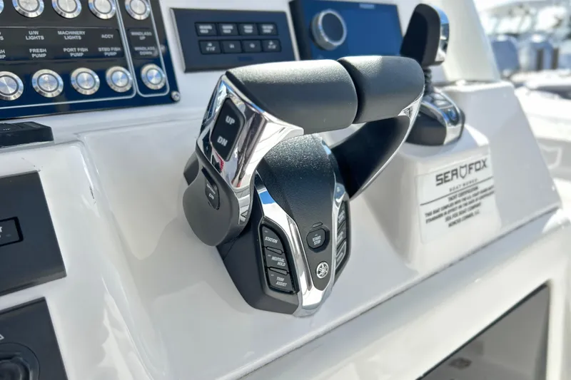 Slide: The Image of Control panel of 2026 Sea Fox 288 Commander boat with advanced throttle system. - 13
