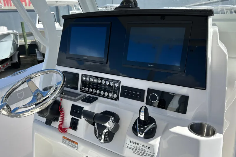 Slide: The Image of 2026 Sea Fox 288 Commander dashboard with dual screens and modern controls. - 14
