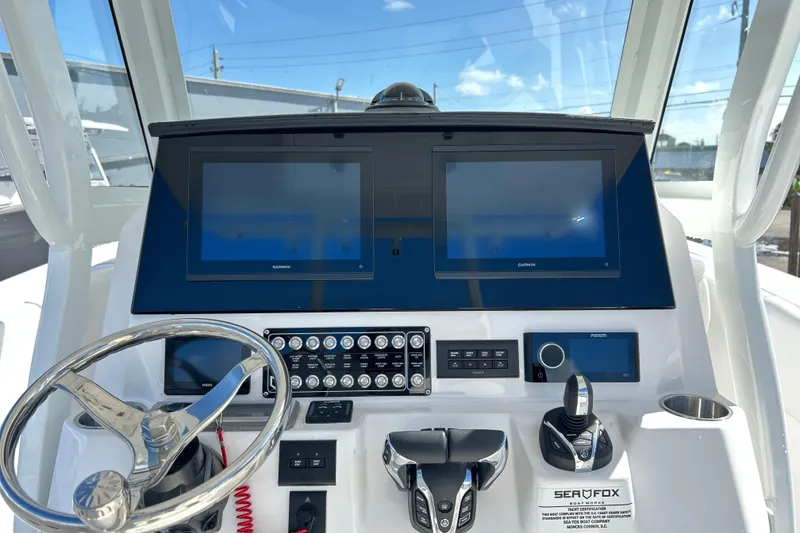 Slide: The Image of 2026 Sea Fox 288 Commander dashboard with dual Garmin displays and modern controls. - 16