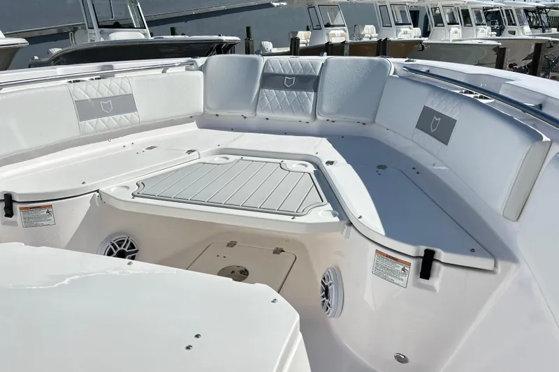 Slide: The Image of 2026 Sea Fox 288 Commander boat interior with cushioned seating and storage compartments. - 19