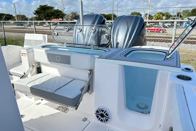 Slide: The Image of 2026 Sea Fox 288 Commander boat interior with seating and dual engines. - 23