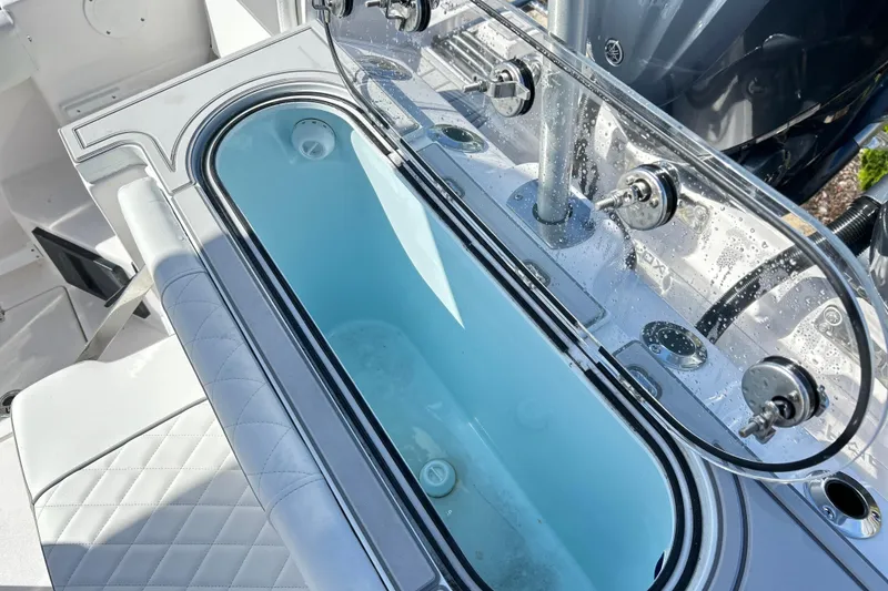 Slide: The Image of Livewell on 2026 Sea Fox 288 Commander boat, featuring clear lid and seating. - 25