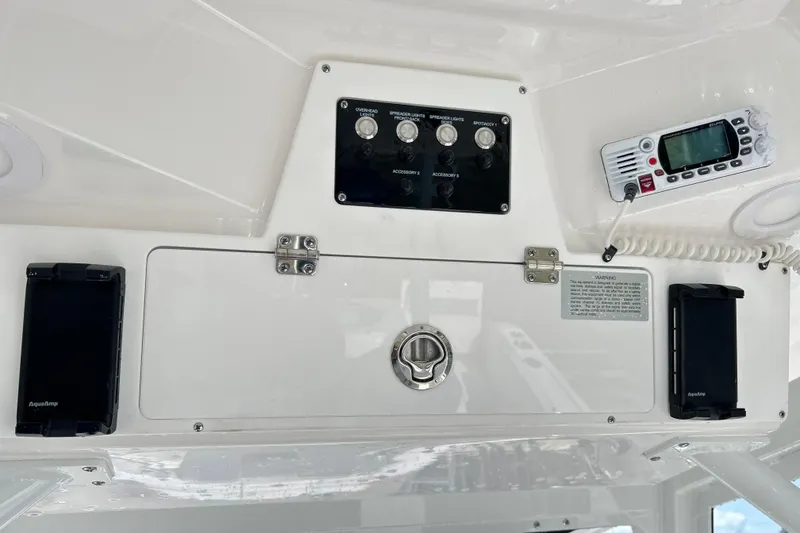 Slide: The Image of 2026 Sea Fox 288 Commander control panel with switches and radio equipment. - 30