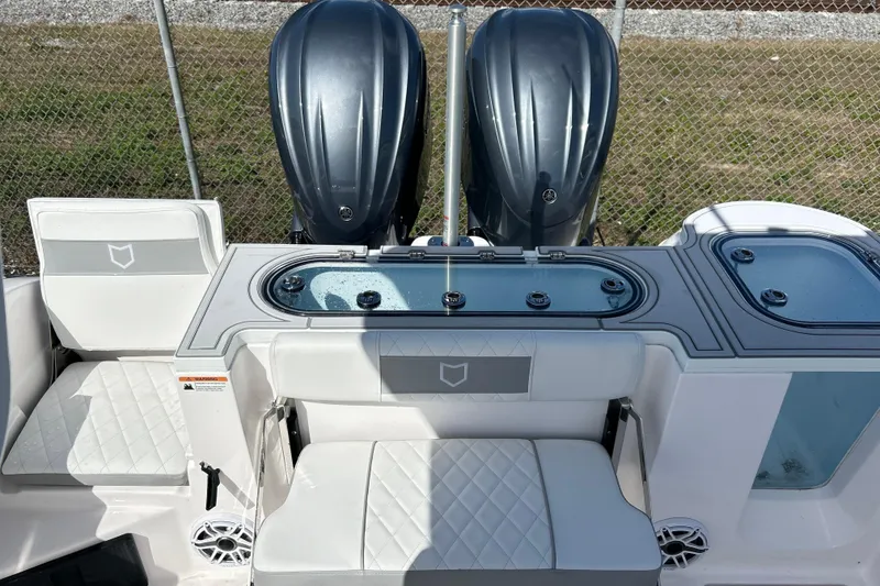 Slide: The Image of 2026 Sea Fox 288 Commander boat interior with dual engines and seating. - 33