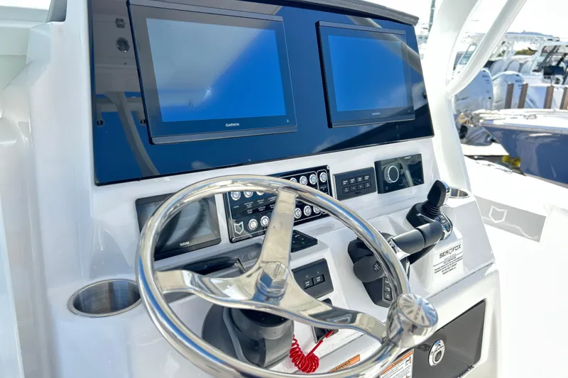 Slide: The Image of Helm of 2026 Sea Fox 288 Commander with dual Garmin displays and controls. - 6