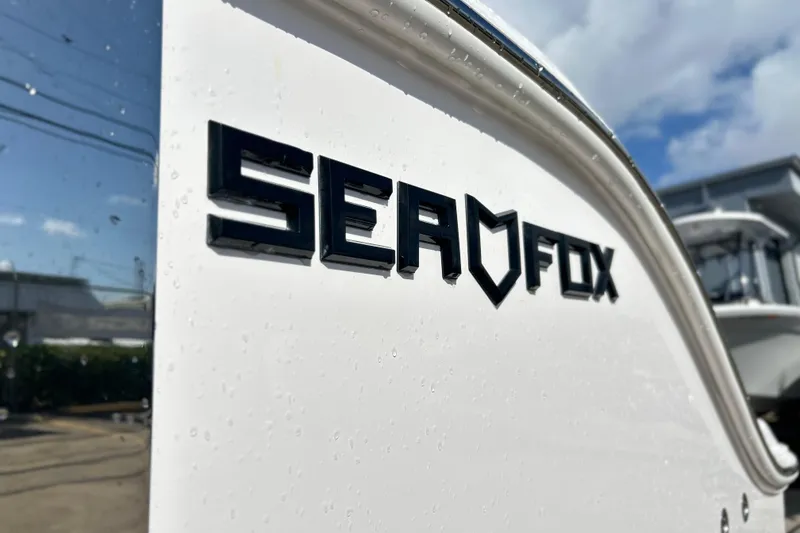 Slide: The Image of 2026 Sea Fox 288 Commander boat logo on sleek white surface. - 8