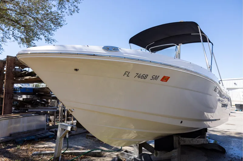 The Image of 2020 Robalo R202 Explorer boat on dry dock under clear blue sky. - 0