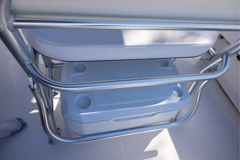 Slide: The Image of 2020 Robalo R202 Explorer boat seat with integrated cooler storage. - 10
