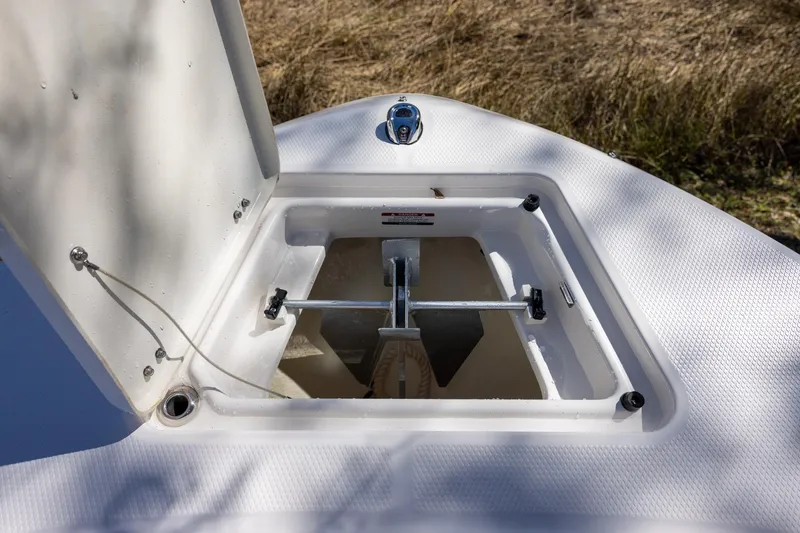 Slide: The Image of Anchor storage compartment on a 2020 Robalo R202 Explorer boat. - 13