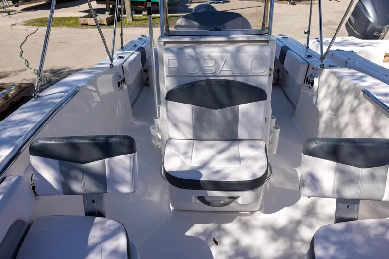 Slide: The Image of 2020 Robalo R202 Explorer boat interior with cushioned seating and sleek design. - 14