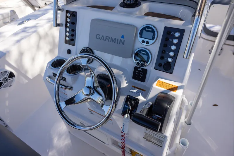 Slide: The Image of 2020 Robalo R202 Explorer boat dashboard with Garmin navigation and Yamaha controls. - 7