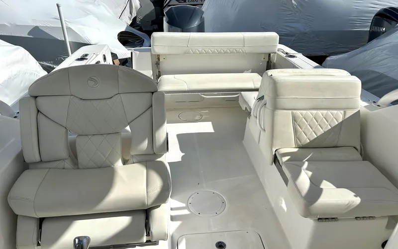 Slide: The Image of 2020 Edgewater 348 CX boat interior with white leather seating and modern design. - 16