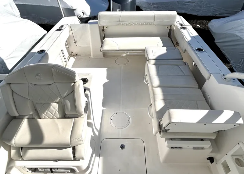 Slide: The Image of 2020 Edgewater 348 CX boat interior with white seating and spacious layout. - 17