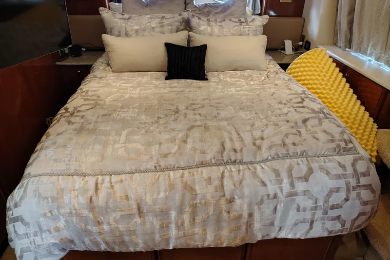 Slide: The Image of Luxurious bedroom interior of 2006 Meridian 459 Motoryacht with plush bedding and pillows. - 10