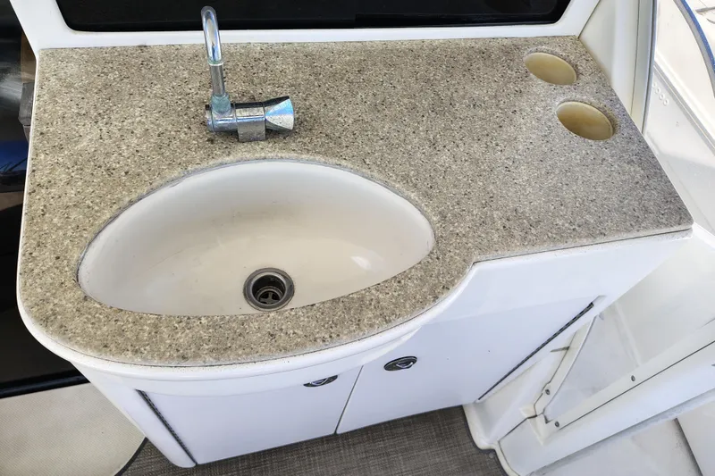 Slide: The Image of 2006 Meridian 459 Motoryacht sink with granite countertop and chrome faucet. - 17