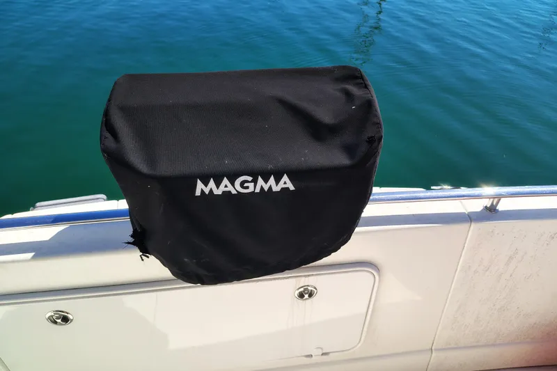 Slide: The Image of Black Magma grill cover on 2006 Meridian 459 Motoryacht, near water. - 21