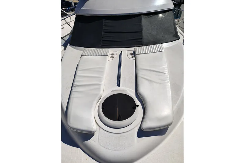 Slide: The Image of 2006 Meridian 459 Motoryacht deck with sunpads and hatch, showcasing luxury design. - 25