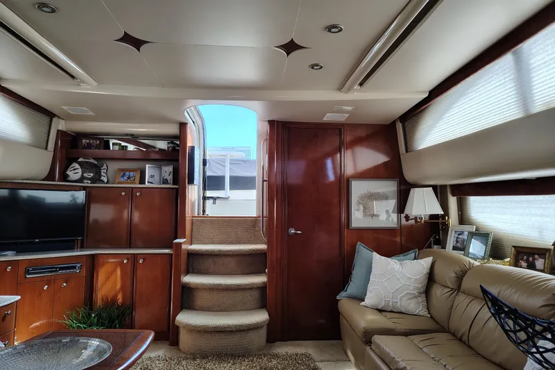 Slide: The Image of Luxurious interior of 2006 Meridian 459 Motoryacht with elegant wood finishes and cozy seating. - 7