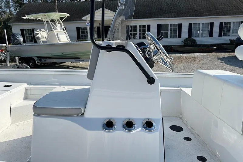 Slide: The Image of 2026 G3 Bay 17 boat interior with steering console and seating. - 10