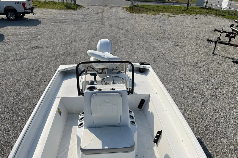 Slide: The Image of 2026 G3 Bay 17 boat interior with seating and steering wheel, parked on gravel. - 5