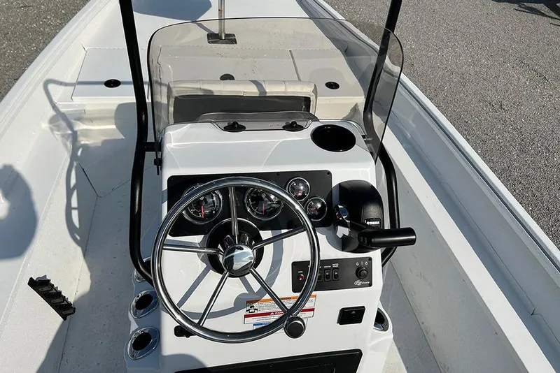 Slide: The Image of 2026 G3 Bay 17 boat console with steering wheel and gauges. - 6