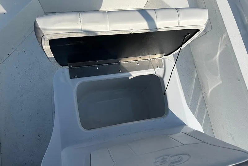 Slide: The Image of Open storage compartment on 2026 G3 Bay 17 boat, featuring cushioned seating. - 7