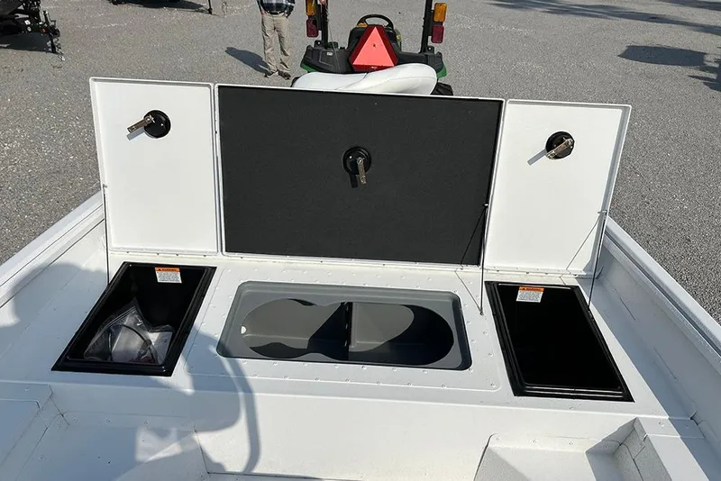 Slide: The Image of 2026 G3 Bay 17 boat storage compartments with open lids, showcasing interior space. - 8