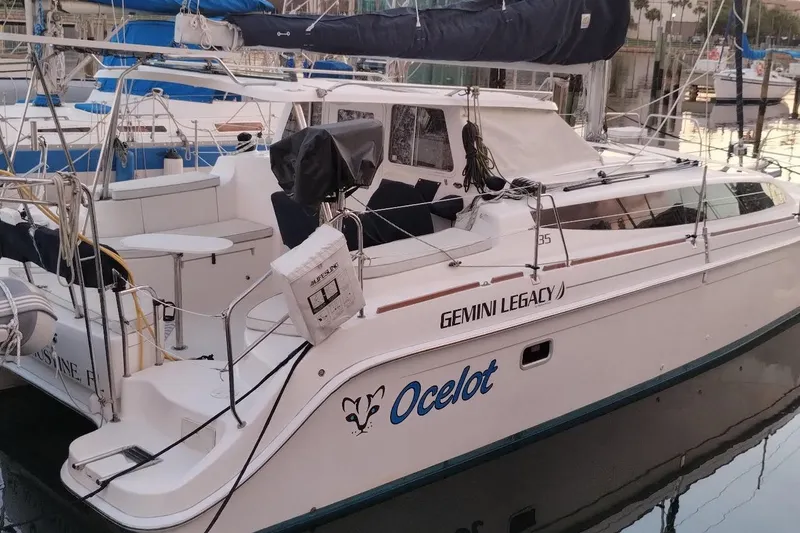 The Image of 2013 Gemini Legacy 35 catamaran named "Ocelot" docked at a marina. - 0