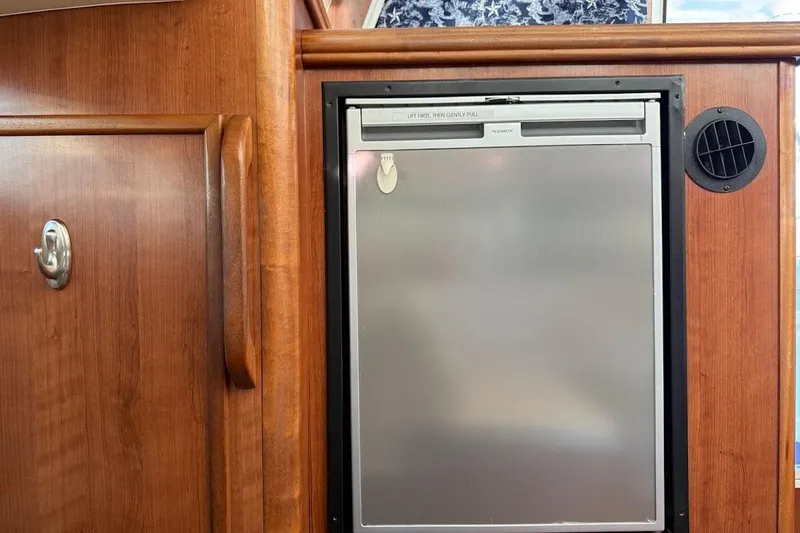 Slide: The Image of Wooden interior of 2013 Gemini Legacy 35 with built-in refrigerator. - 11