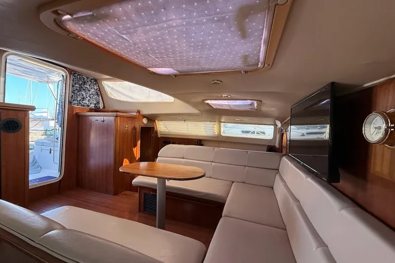 Slide: The Image of Luxurious interior of 2013 Gemini Legacy 35 yacht with plush seating and wooden accents. - 15