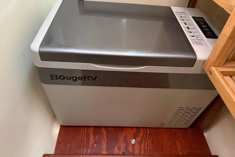 Slide: The Image of Portable BougeRV refrigerator inside a 2013 Gemini Legacy 35 boat cabin. - 22