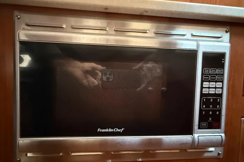Slide: The Image of Built-in Franklin Chef microwave in a 2013 Gemini Legacy 35 yacht kitchen. - 23