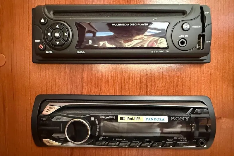 Slide: The Image of Car stereo systems in a 2013 Gemini Legacy 35, featuring Boss and Sony models. - 29