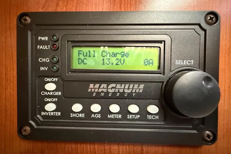 Slide: The Image of Magnum Energy control panel displaying full charge, DC 13.2V, on a Gemini Legacy 35. - 30