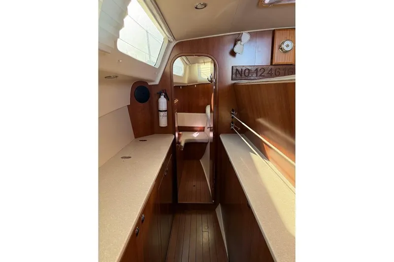 Slide: The Image of Interior of 2013 Gemini Legacy 35 sailboat with wood finish and natural light. - 34