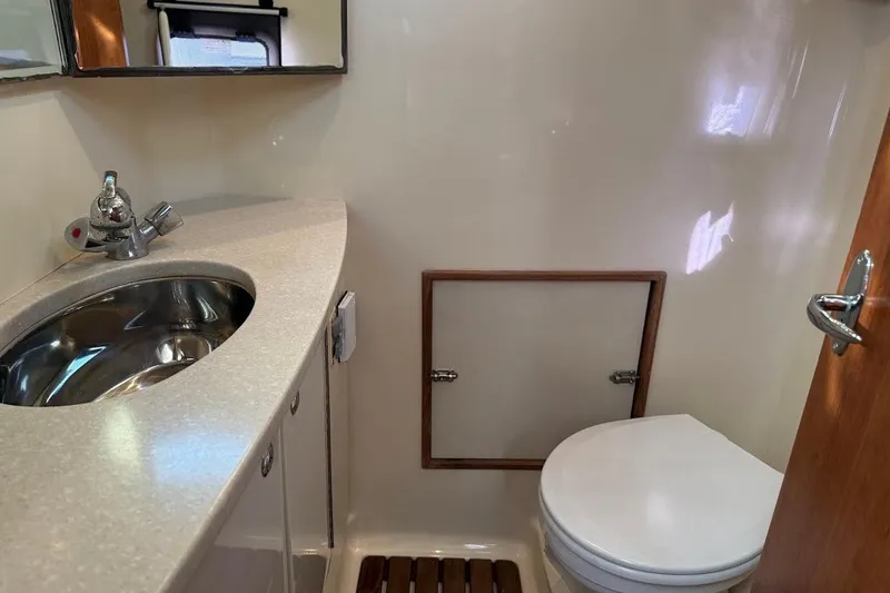 Slide: The Image of Compact bathroom in 2013 Gemini Legacy 35 boat with sink and toilet. - 35