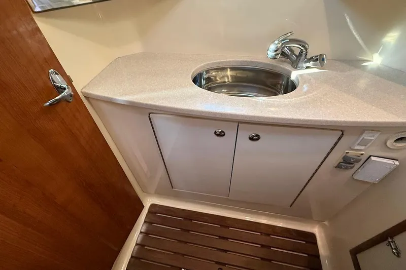 Slide: The Image of 2013 Gemini Legacy 35 yacht bathroom with sink and wooden floor. - 36