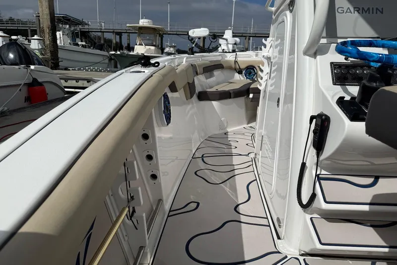 Slide: The Image of 2022 Tidewater 292 CC Adventure boat interior with modern design and advanced navigation equipment. - 13