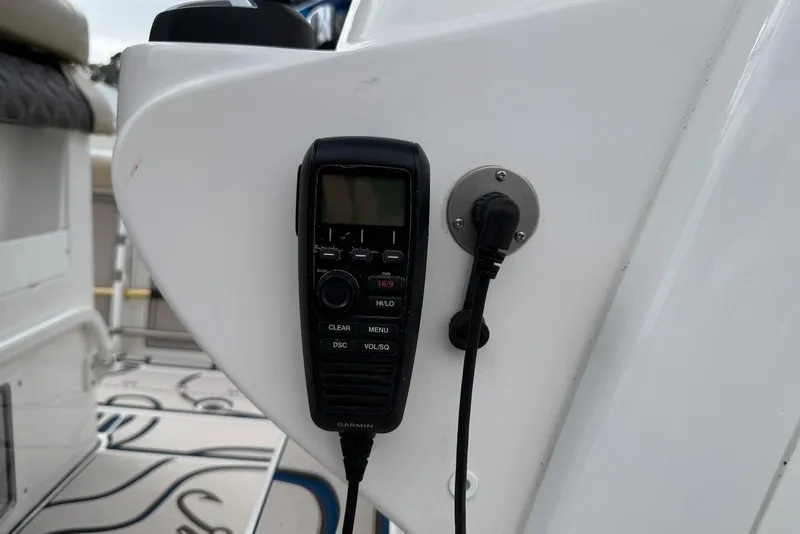 Slide: The Image of VHF radio on 2022 Tidewater 292 CC Adventure boat console. - 14