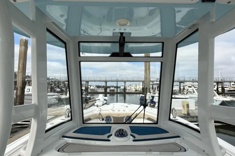 Slide: The Image of 2022 Tidewater 292 CC Adventure boat interior view at marina. - 18