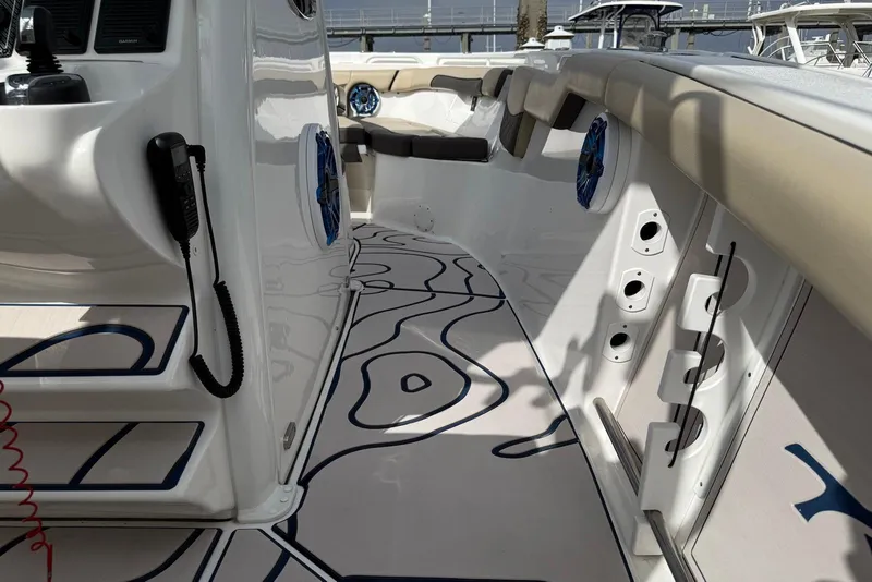 Slide: The Image of 2022 Tidewater 292 CC Adventure boat interior with modern design and seating. - 19