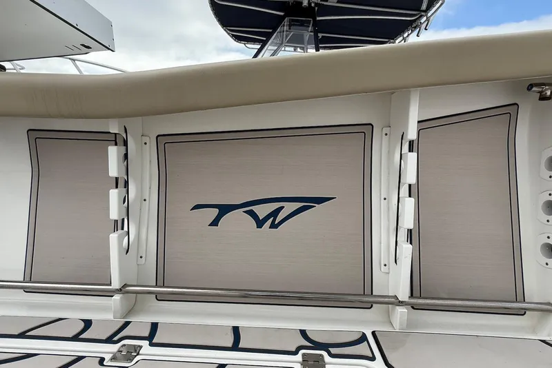 Slide: The Image of 2022 Tidewater 292 CC Adventure boat interior with logo and seating details. - 22