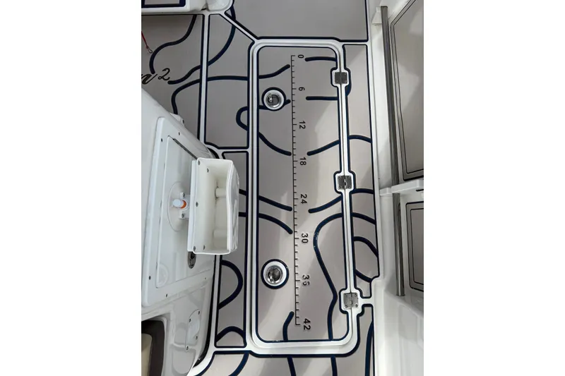 Slide: The Image of 2022 Tidewater 292 CC Adventure boat deck with integrated measuring ruler. - 27