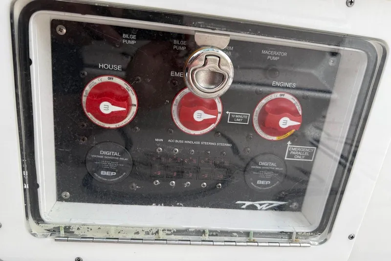 Slide: The Image of Control panel of 2022 Tidewater 292 CC Adventure boat with switches and dials. - 32
