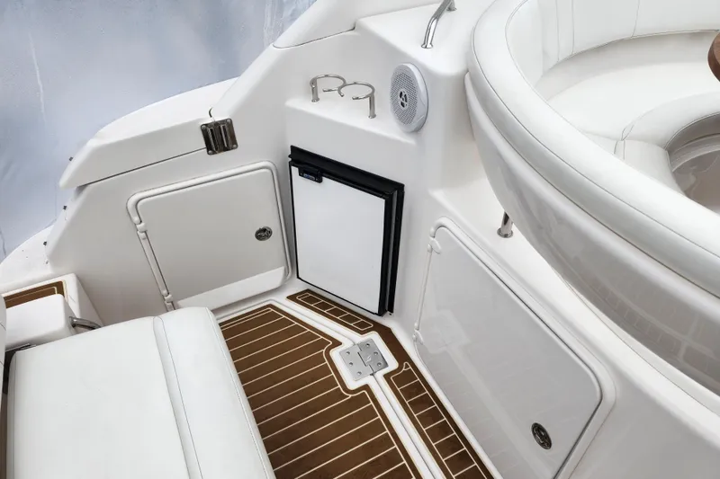 Slide: The Image of Coiled yellow power cable in 2011 Regal 3060 Express Cruiser compartment. - 10