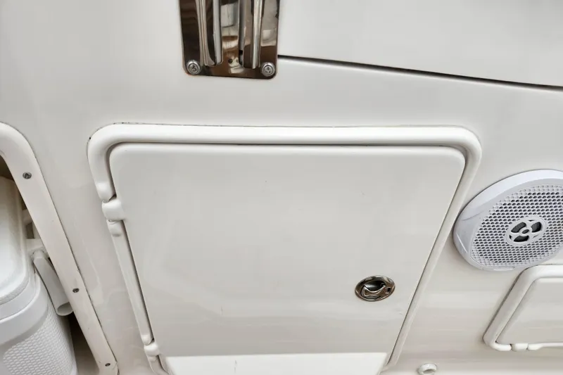 Slide: The Image of Open refrigerator inside 2011 Regal 3060 Express Cruiser boat, showing empty shelves. - 12