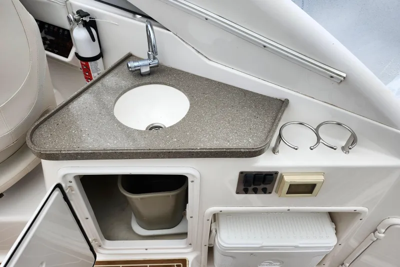 Slide: The Image of Storage compartment in 2011 Regal 3060 Express Cruiser with rolled canvas. - 14